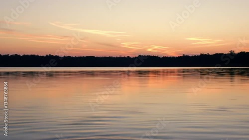 Wallpaper Mural Serene Sunset over Lake: Capturing the tranquil beauty of dusk with a picturesque view of a calm lake reflecting the colorful sky and the silhouette of trees. Torontodigital.ca