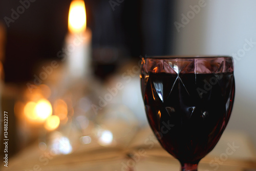 Obraz na płótnie Books, lit candles, red wine, snacks and various deocration on the table. Dark academia or Halloween concept. Selective focus. w salonie