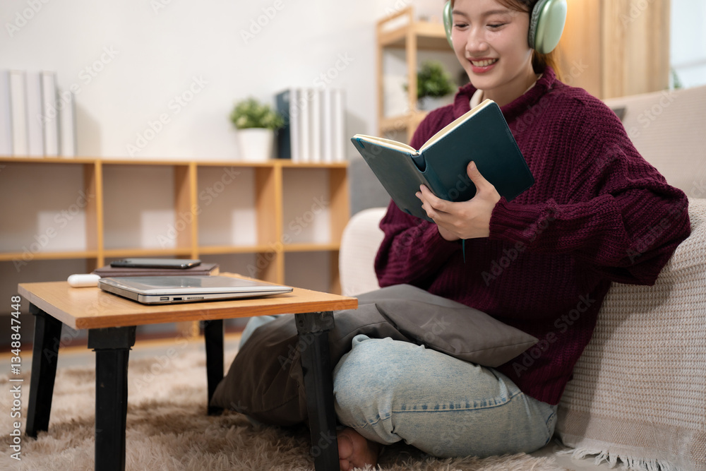 Lifestyle people. Woman reading a book and using laptop and enjoys a coffee. home office workplace. Lifestyle people. Woman reading a book and using laptop and enjoys a coffee. home office workplace.