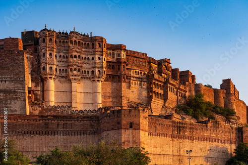 India. State of Rajasthan. Jodhpur. Mehrangarh Fort (historic stronghold of the Rathore Rajput royal rulers). Outer walls and ramparts, colonnaded walkways in a golden late afternoon light