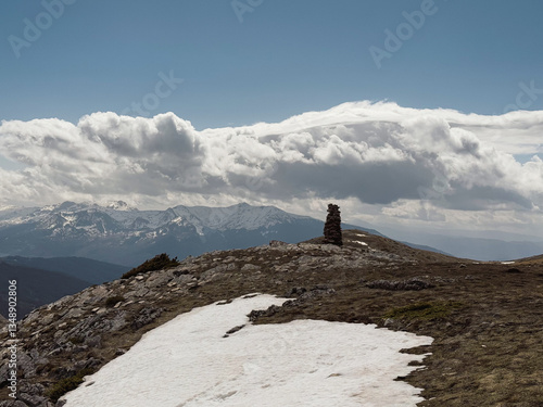 Explorers trek through the scenic landscapes of Mavrovo Galichnik, North Macedonia, encountering snow and breathtaking mountain vistas while hiking along the trails