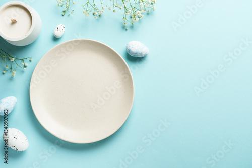 Easter table setting on blue.