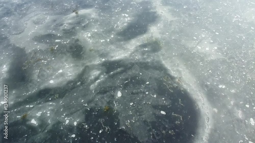 aerial footage of frozen Loch Beanie - a scottish mountain lake in the highlands
