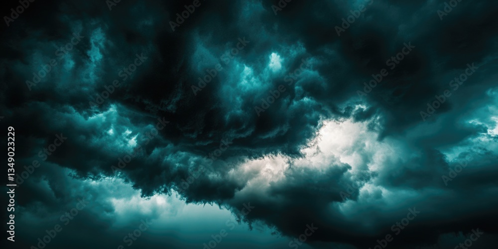 A stormy sky with dark, ominous clouds looming over a landscape. A stormy sky with dark, ominous clouds looming over a landscape.