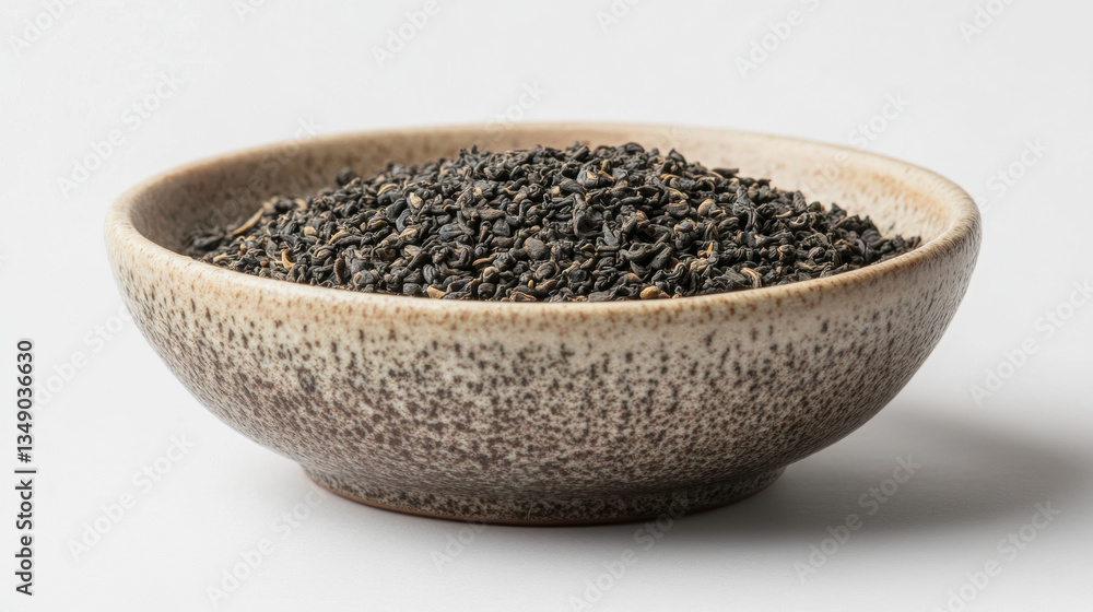 assam black tea dried in a bowl on white background. assam black tea dried in a bowl on white background.