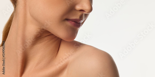 Konstfotografi Cropped image of female face, neck and bare shoulders, young woman with glowing skin, emphasizing neck and jawline beauty