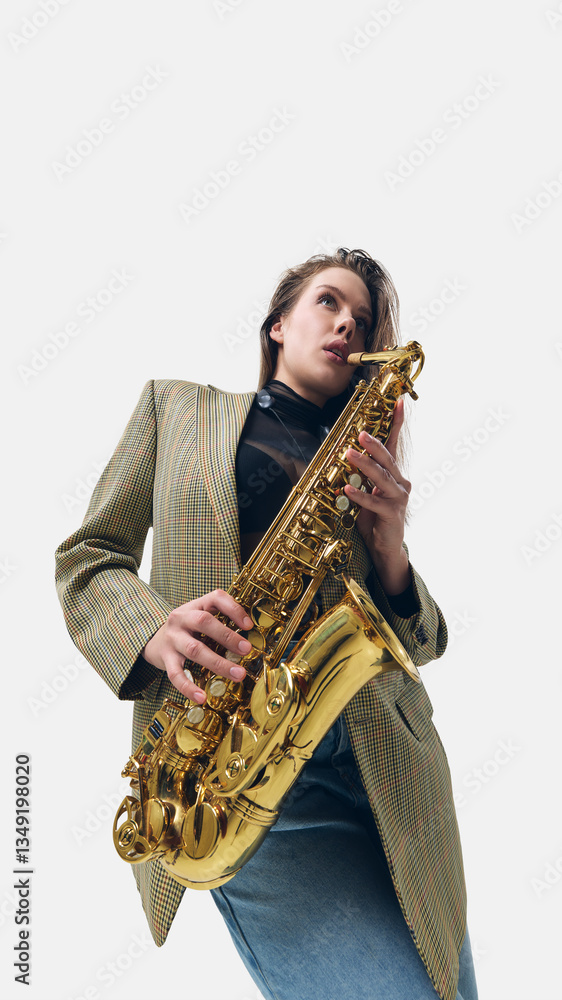 Fototapeta premium Low-angle image of woman in blazer, fingers pressing golden saxophone keys, fully immersed in rhythm, playing on white background. Concept of music, jazz, festival, performance, artistic life, energy