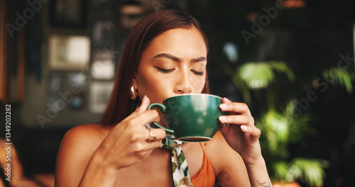 Drinking, coffee and woman in cafe, relax and customer with hot beverage in morning, latte and enjoy. Break, consumer and person with cup in shop, calm and aroma of tea in store, taste or flavor