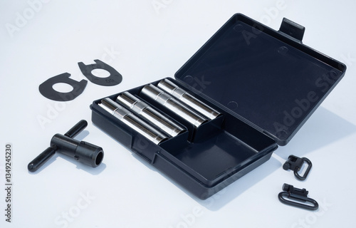 Obraz na płótnie Plastic case holding choke tubes and accessories for a hunting shotgun w salonie