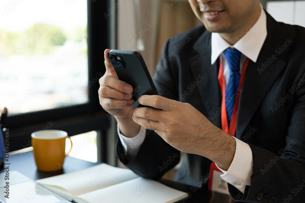 A man in a suit is working on documents in an office. He holds a pen and is analyzing data. This scene conveys a professional working atmosphere.
A man in a suit is working on documents in an office. He holds a pen and is analyzing data. This scene conveys a professional working atmosphere.