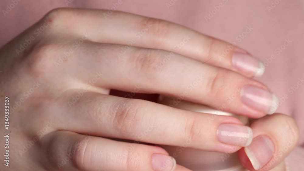 opening a skincare jar with acid-based cream. close-up of female hands twisting the lid of a cosmetic container. concept of skin hydration, whitening treatment, and beauty care opening a skincare jar with acid-based cream. close-up of female hands twisting the lid of a cosmetic container. concept of skin hydration, whitening treatment, and beauty care