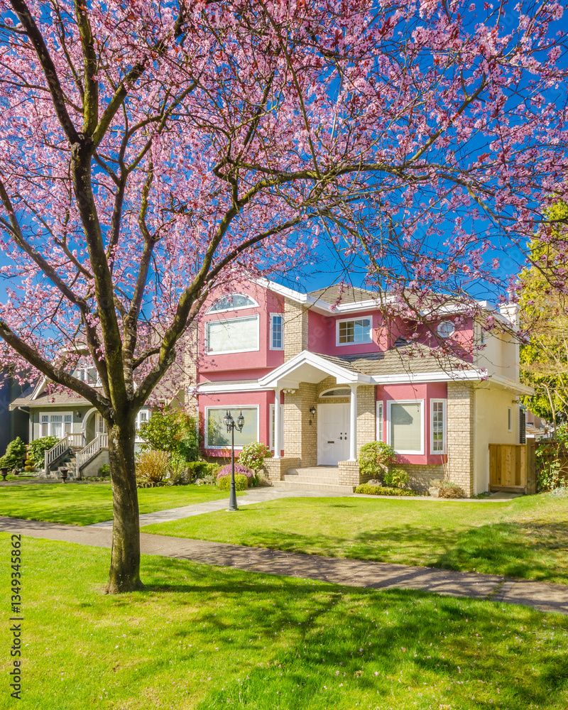 Obraz premium Two story luxury house with beautiful summer landscape in Vancouver, Canada, North America. Day time on June 2024