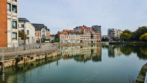 Photos Scenic Reflection of Historic Buildings on a Tranquil Waterway at Le quai du Wau