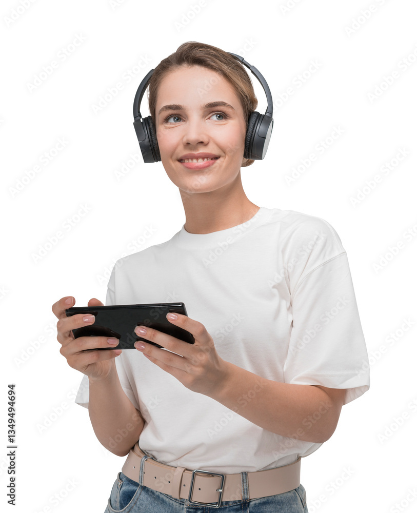 Smiling woman in white t-shirt and jeans wearing headphones, holding smartphone, playing or streaming media. Isolated on white background, technology concept Smiling woman in white t-shirt and jeans wearing headphones, holding smartphone, playing or streaming media. Isolated on white background, technology concept
