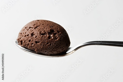 A spoonful of rich, dark chocolate mousse, creamy and decadent.