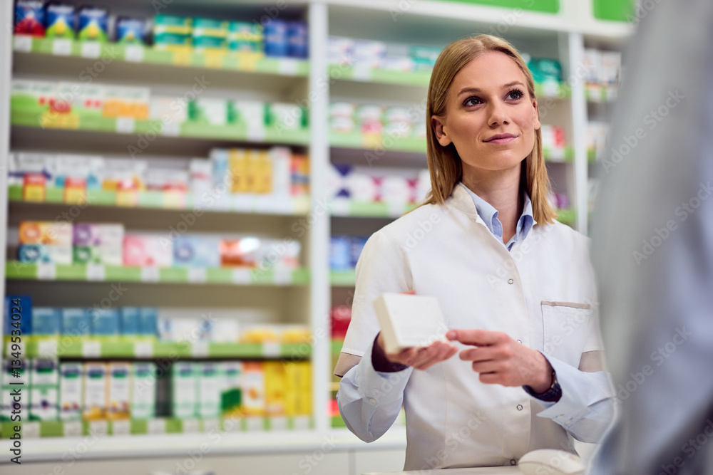 Friendly Female Pharmacist Assisting a Customer in a Modern Pharmacy Setting