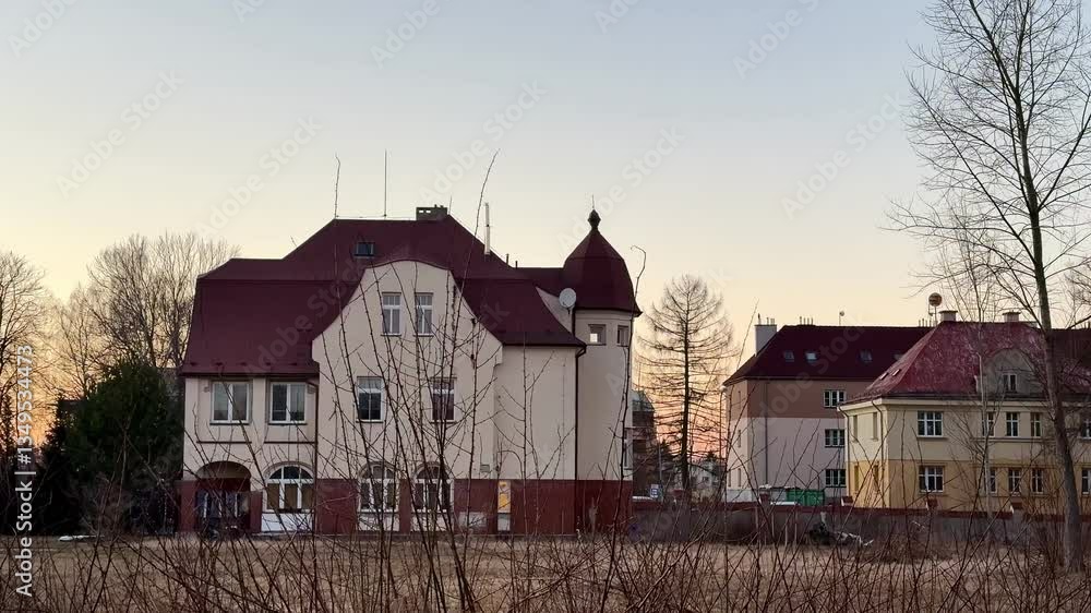 The captivating, enchanting view showcases historic buildings beautifully set against a tranquil sunset backdrop The captivating, enchanting view showcases historic buildings beautifully set against a tranquil sunset backdrop