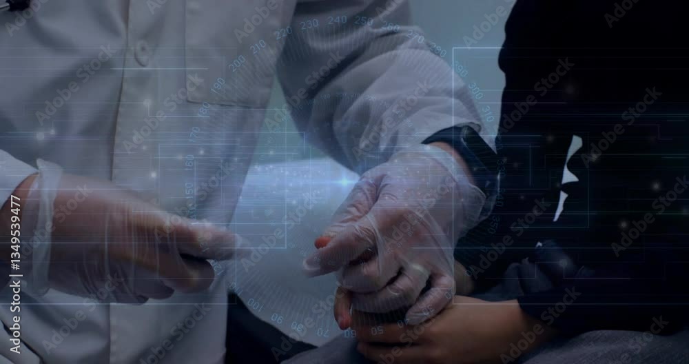 Examining patient, medical professional using digital interface in hospital setting Examining patient, medical professional using digital interface in hospital setting
