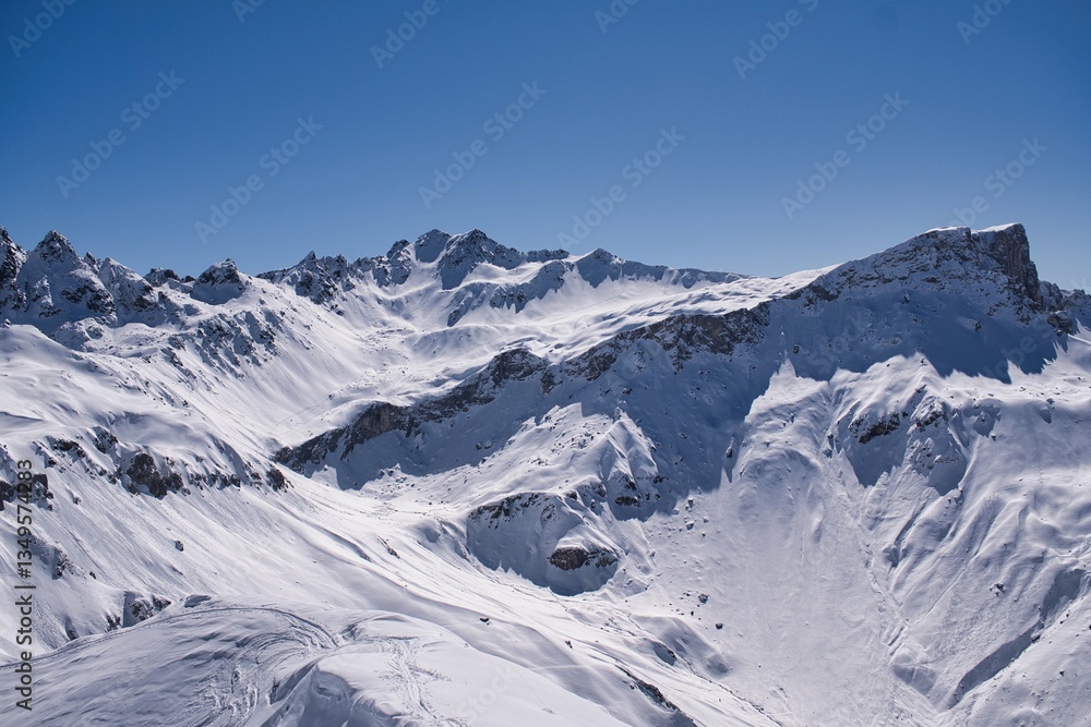 View from the ski touring mountain Gämpiflua towards the Madrisahorn and Rätschahorn above Sankt Antönien. Beautiful winter panorama in the Luzein region in the canton of Graubünden. Gämpliflue. View from the ski touring mountain Gämpiflua towards the Madrisahorn and Rätschahorn above Sankt Antönien. Beautiful winter panorama in the Luzein region in the canton of Graubünden. Gämpliflue.