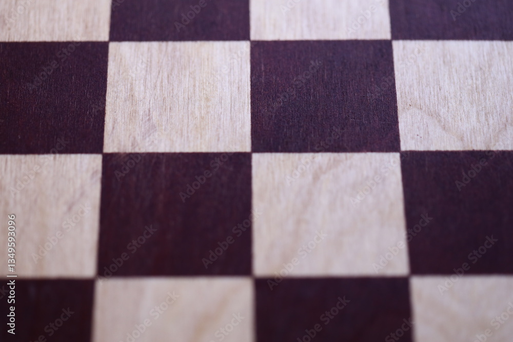 Fototapeta premium A detailed shot of a chessboard, ideal for highlighting game pieces or strategy planning.