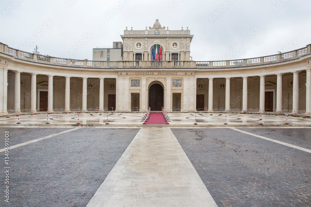 Obraz premium Facade of the Emiciclo Palace, also known as the Exposition Palace. It is a monumental complex in L' Aquila, Italy, seat of the Regional Council of Abruzzo.