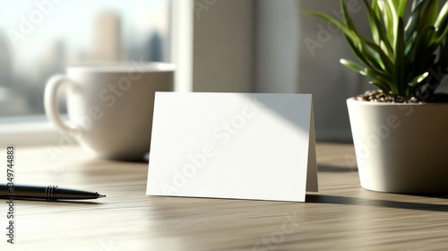 Blank note card on office desk with coffee cup