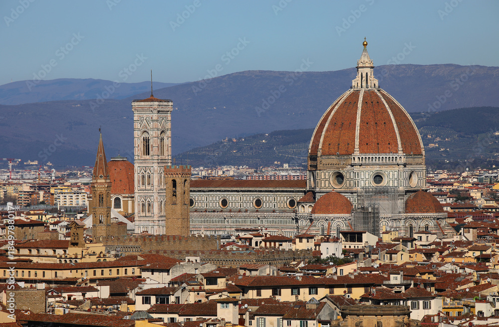 Fototapeta premium Florence cathedral in ITALY with bell tower of Giotto and dome of Brunelleschi and the hills in the background