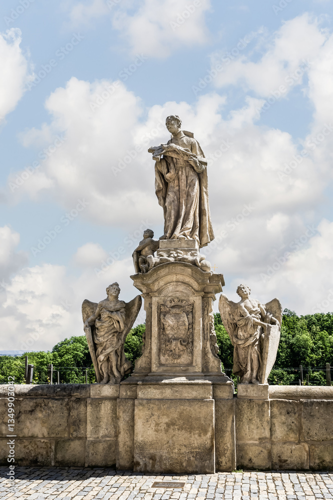 Fototapeta premium Stone statue of King Ferdinand III of Castile stands on parapet of Baroque Gallery in Kutna Hora in Czech Republic