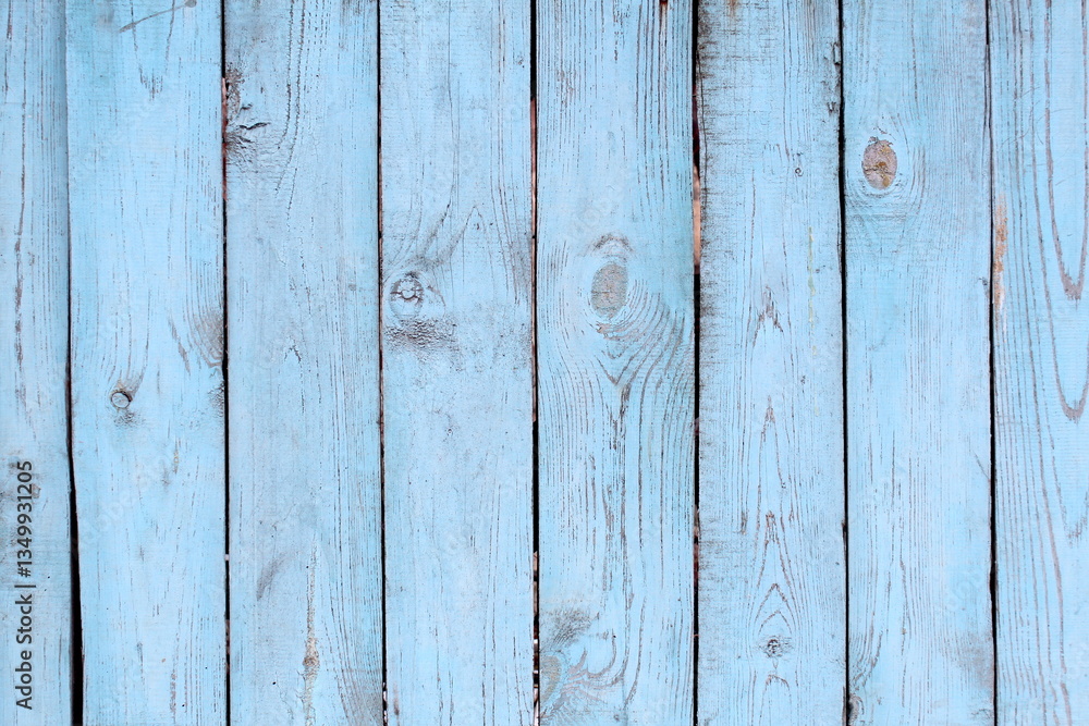 Naklejka premium Texture of wooden fence painted with blue paint.