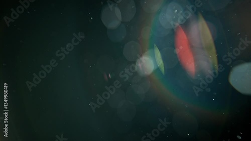 Slow motion real lens flare through glass effects for overlay or transition