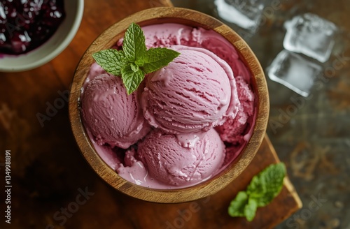 Delicious Purple Ice Cream in a Wooden Bowl Garnished With Mint Leaves and Bl...