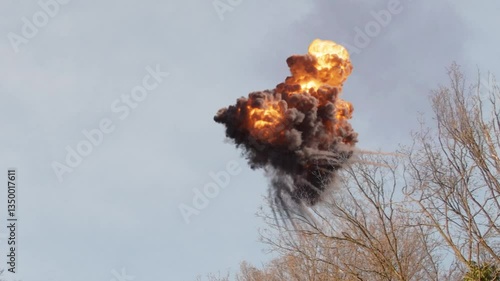 Missile shoots down kamikaze drone in sky, air burst.