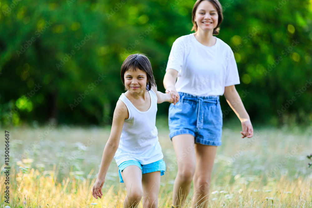 Portrait of sisters spending time together in park in summer