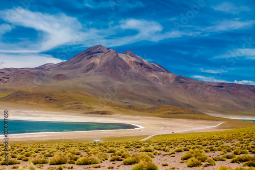 Lagunas altiplanicas Miniques and Miscanti in Chile Atacama desert near San Pedro de Atacama village. Tourist attractions natural sights of Chilean Atacama desert. Dry soil and volcano mountain Andes