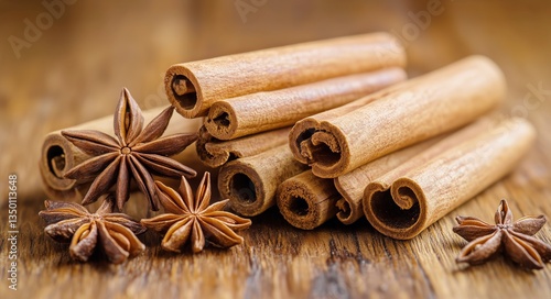 Cinnamon Sticks and Star Anise Arranged on Rustic Wooden Surface for Culinary...
