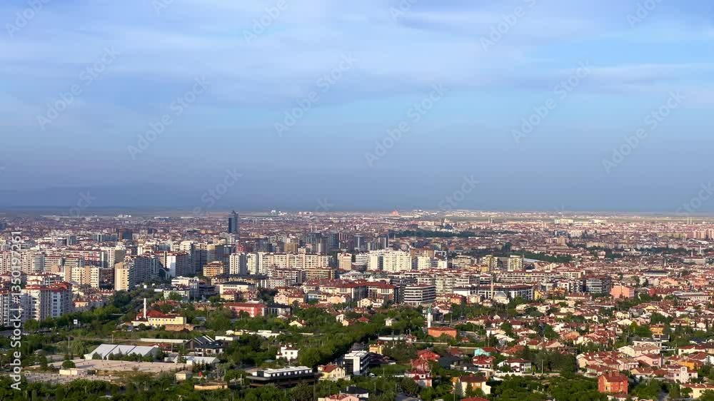 Konya city observation deck with mosques and minarets. Konya city landscape from a bird's-eye view. Panorama of the city. View of Konya city from the hills.4K Konya city observation deck with mosques and minarets. Konya city landscape from a bird's-eye view. Panorama of the city. View of Konya city from the hills.4K