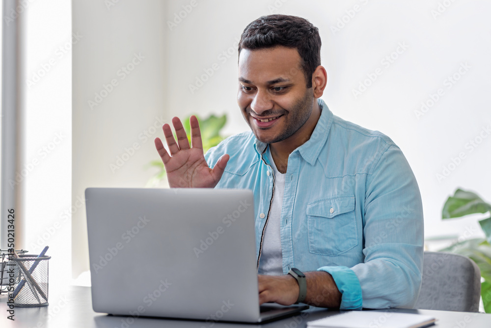 Happy businessman having online video call home