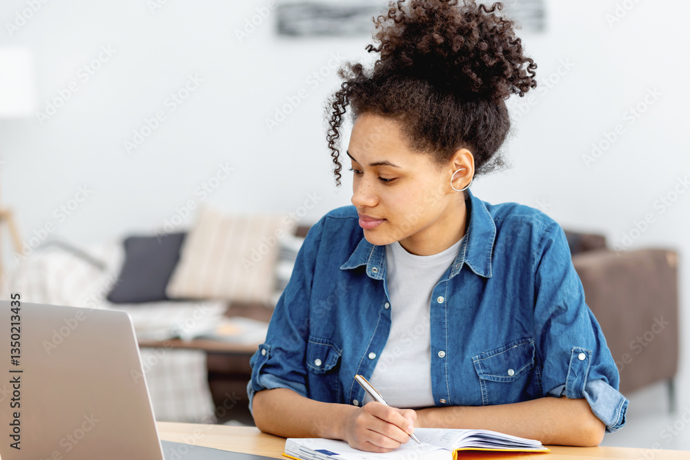 Young woman studying or working at hom