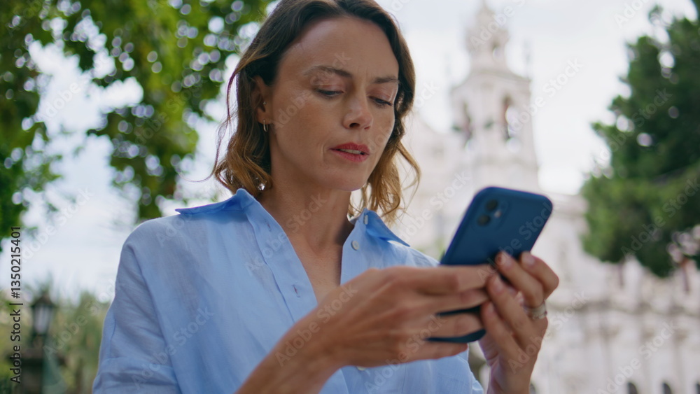 Focused woman chatting smartphone at summer park closeup. Lady waiting friend Focused woman chatting smartphone at summer park closeup. Lady waiting friend
