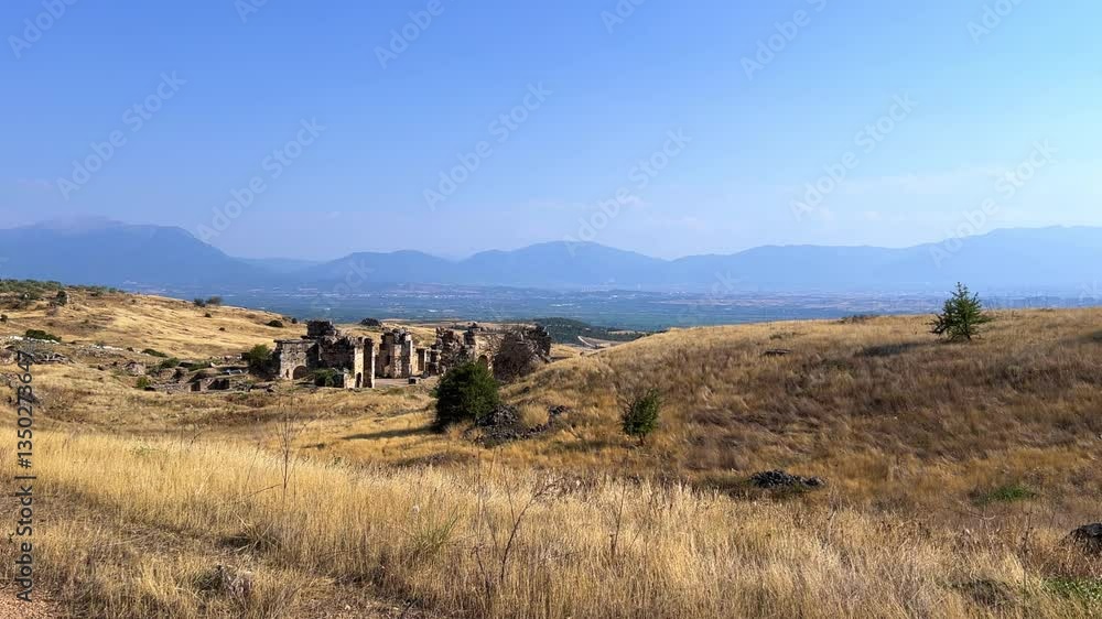 HIERAPOLIS in Denizli, TURKEY, August 13, 2024: The ancient city of Hierapolis near Pamukkale, against the backdrop of nature and mountains. The Phrygian period.UNESCO.4K HIERAPOLIS in Denizli, TURKEY, August 13, 2024: The ancient city of Hierapolis near Pamukkale, against the backdrop of nature and mountains. The Phrygian period.UNESCO.4K