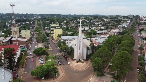 Stunning aerial shot of Obera Cathedral, Misiones, Argentina. The drone approaches, revealing the architectural beauty and natural surroundings.