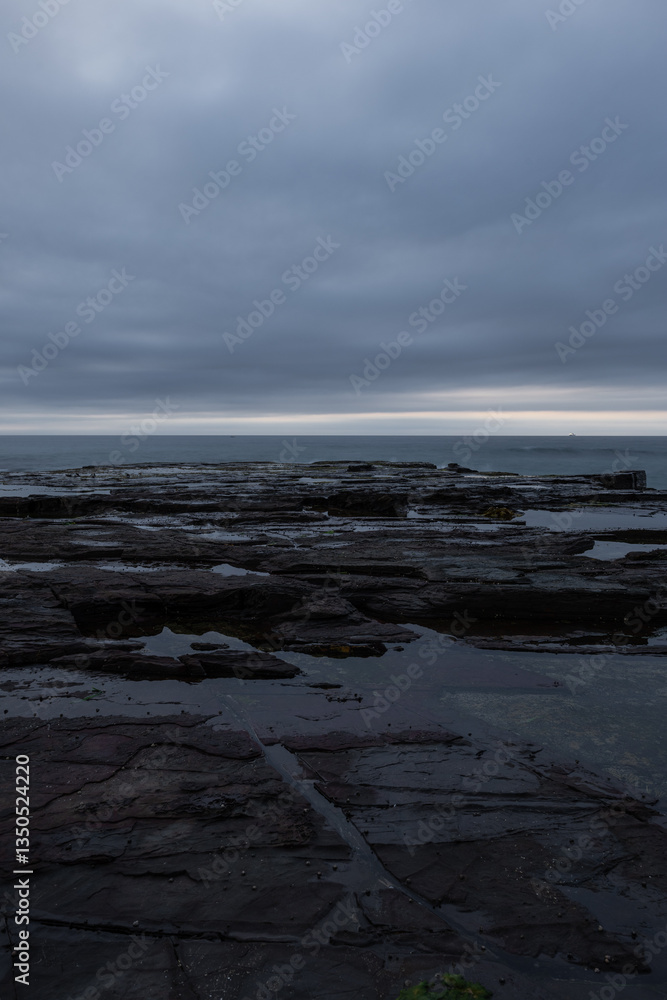 Fototapeta premium Rock formation and cloudy sky.