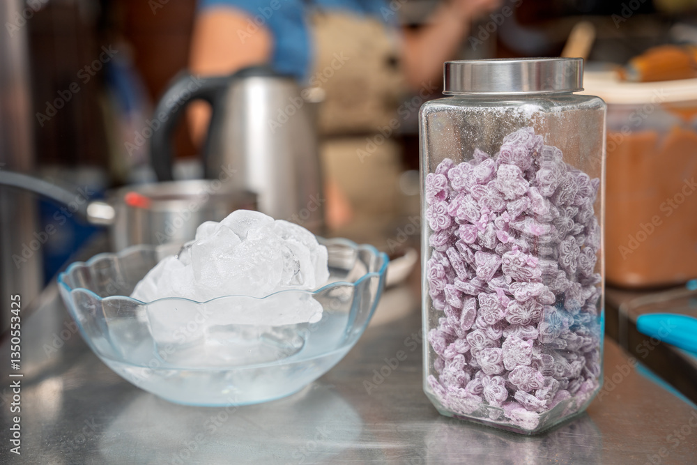 Pastry chef preparing ingredients, ice and candies in a kitchen Pastry chef preparing ingredients, ice and candies in a kitchen