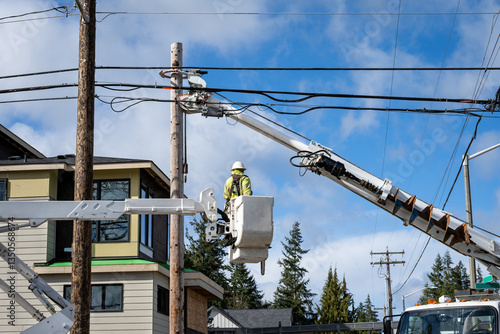 Cuadro en lienzo Utility digger derrick truck with pole setting equipment, lineman in lift bucket