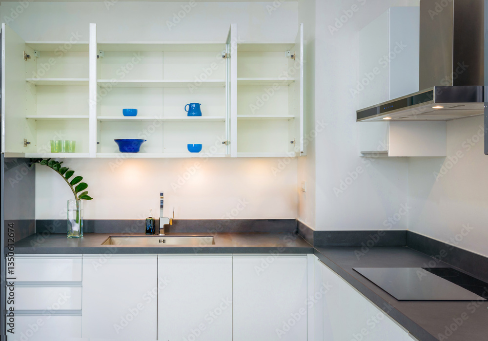 Modern Minimalist Kitchen Interior with Sleek Design and Bright Blue Accents on Shelves and Countertop Modern Minimalist Kitchen Interior with Sleek Design and Bright Blue Accents on Shelves and Countertop