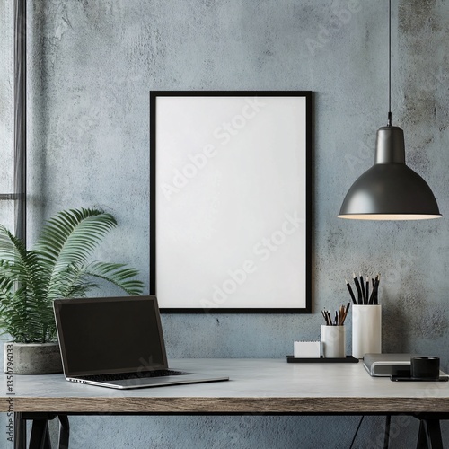 Minimalist Workspace Setup Featuring Laptop Framed Artwork and Industrial Style Lighting Design