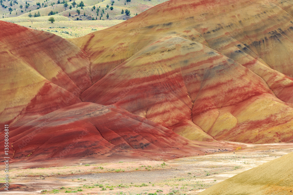 North America, United States, Oregon, Central Oregon, Redmond, Bend, Mitchell. Series of low clay hills striped in colorful bands of minerals, ash and clay deposits.