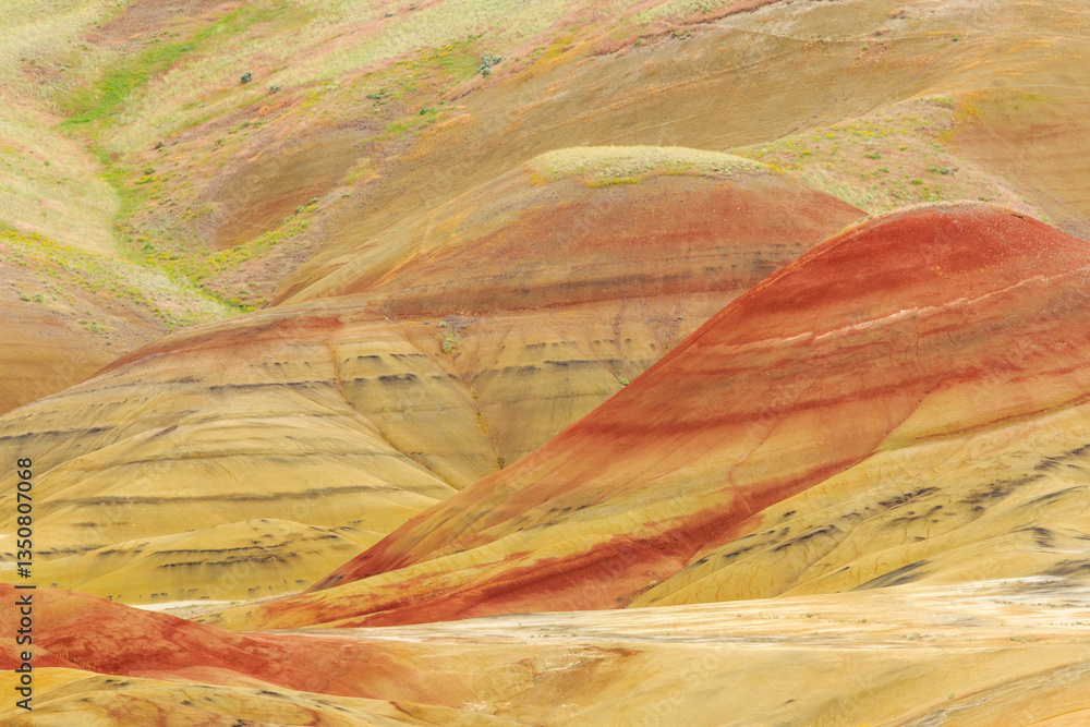 North America, United States, Oregon, Central Oregon, Redmond, Bend, Mitchell. Series of low clay hills striped in colorful bands of minerals, ash and clay deposits.
