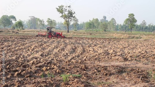 tractor is working in the rice field.