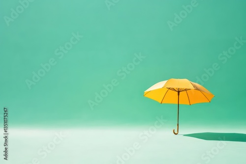 Wallpaper Mural Yellow umbrella, teal background, studio shot, protection concept Torontodigital.ca